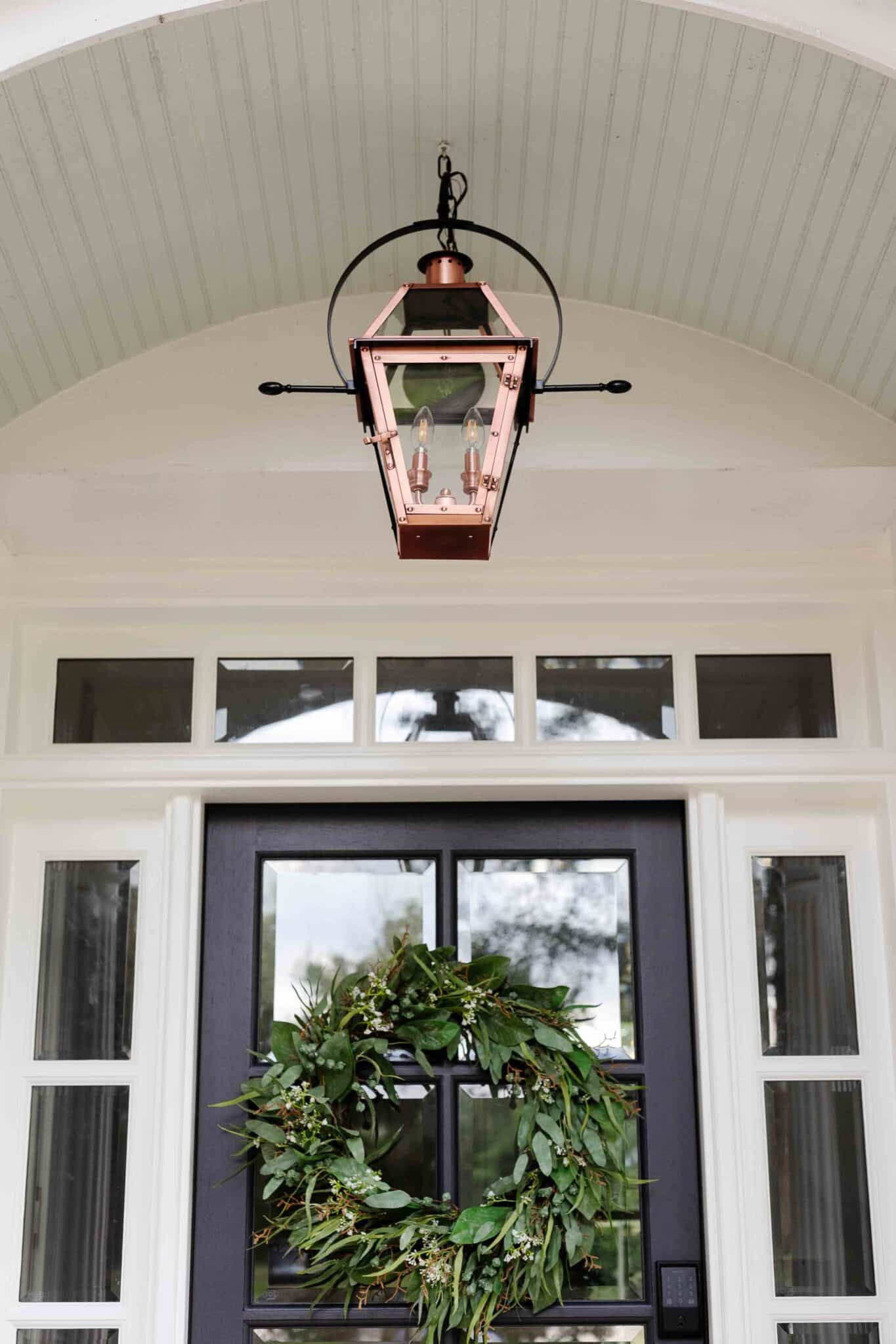 copper gas lantern lookalike inspired by Charleston on a colonial front porch