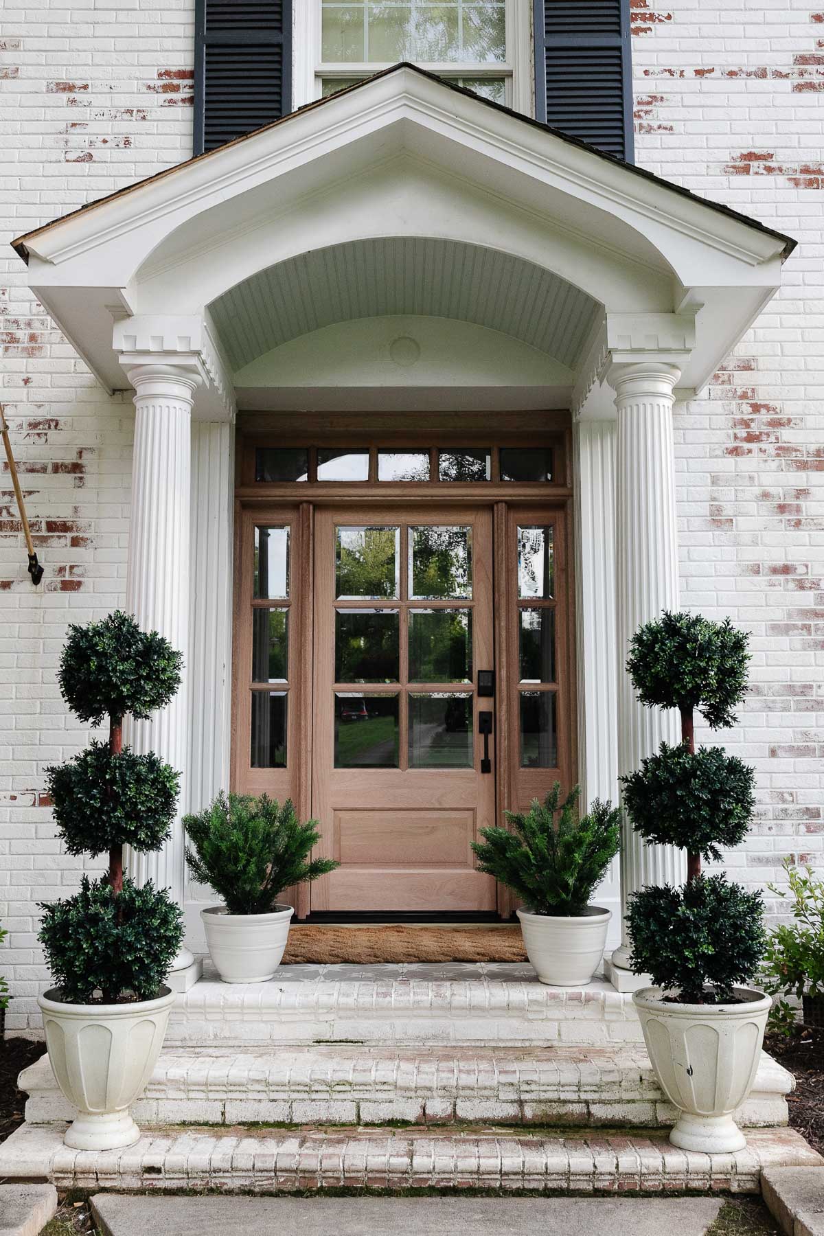 wood front door with glass panes