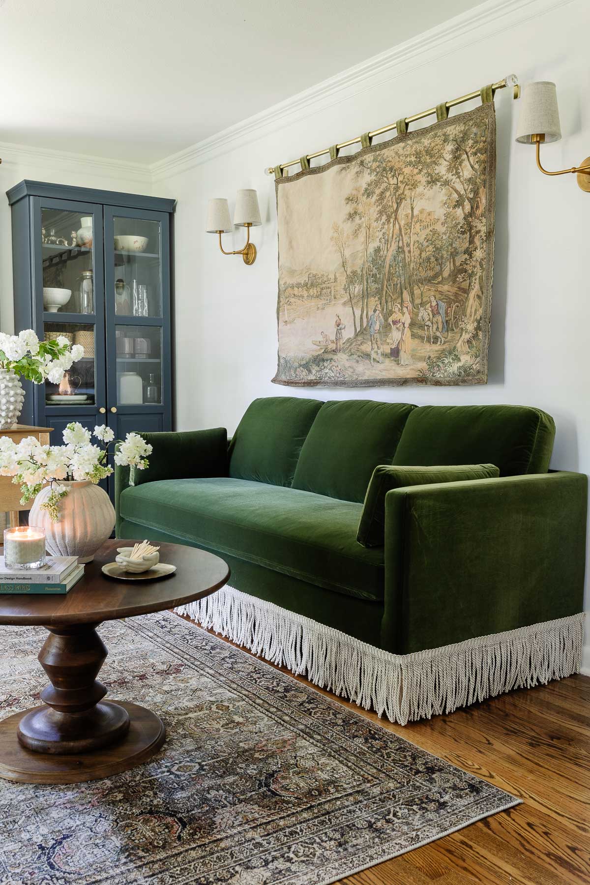 green velvet sofa with fringe