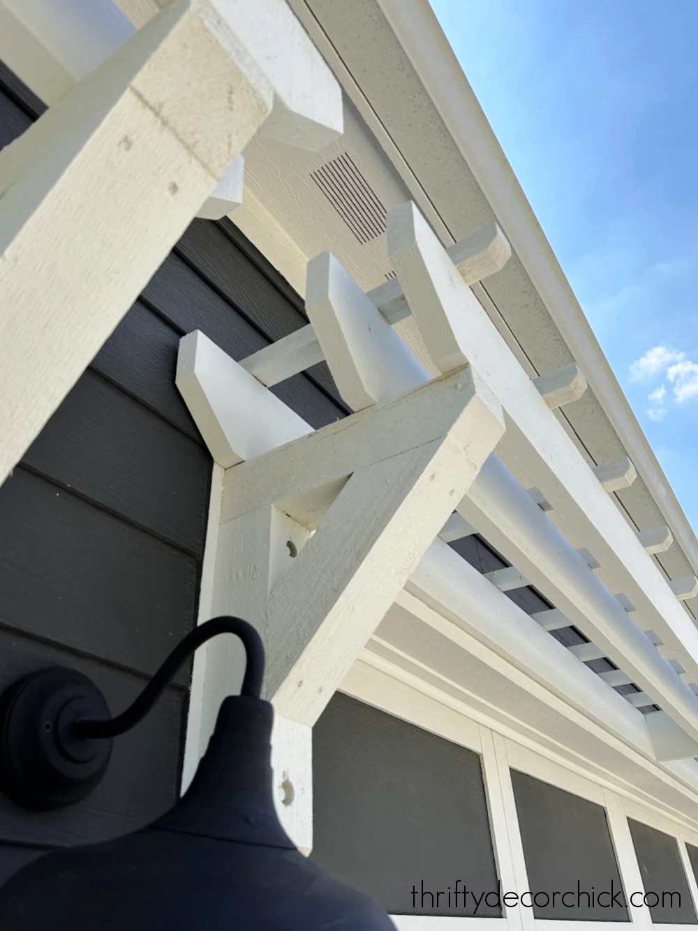 white pergola over garage