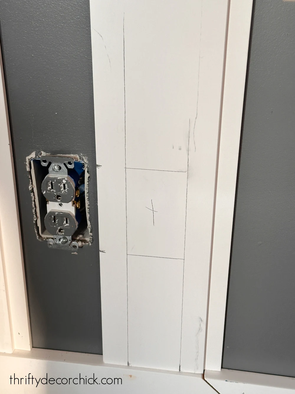 measuring for an outlet on wall