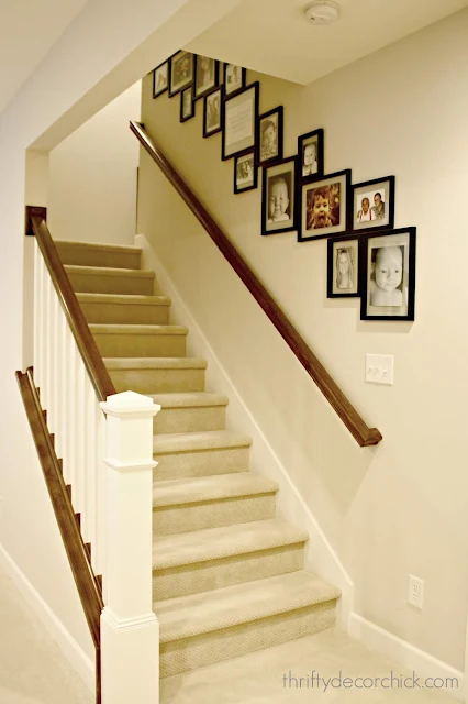 Gallery wall with photos down the stairs