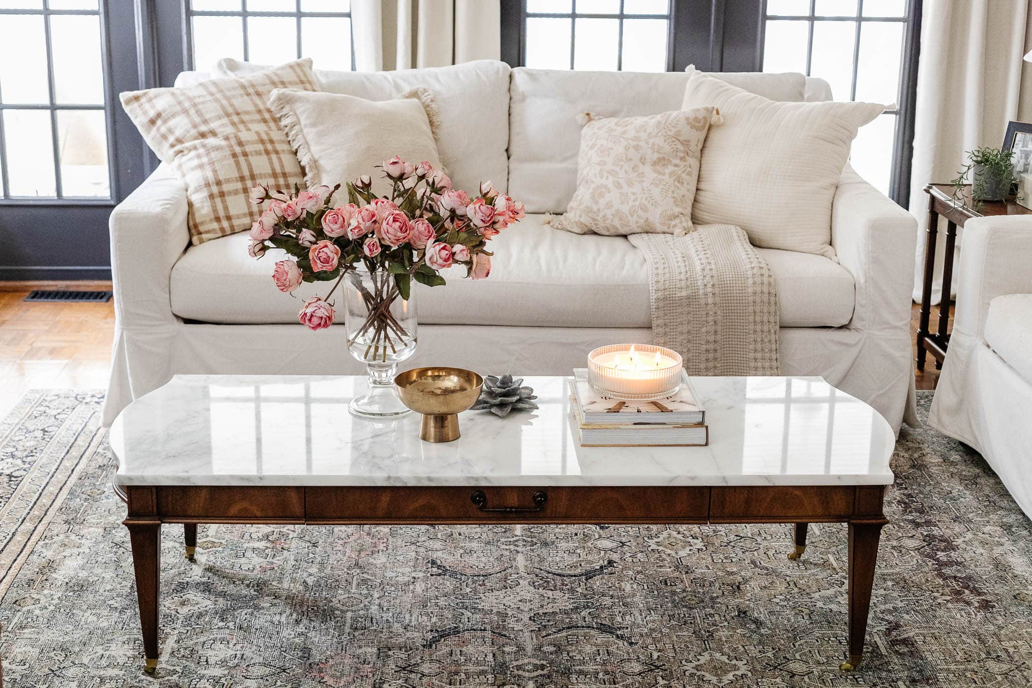 mix and match throw pillows on sofa in living room