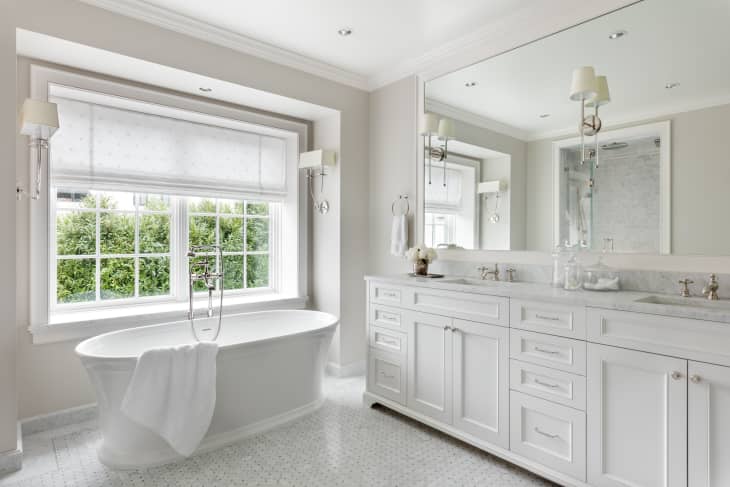 Bathroom painted with Benjamin Moore’s Revere Pewter, a pale gray color