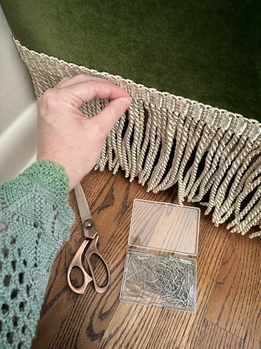 adding fringe trim to a sofa with straight pins