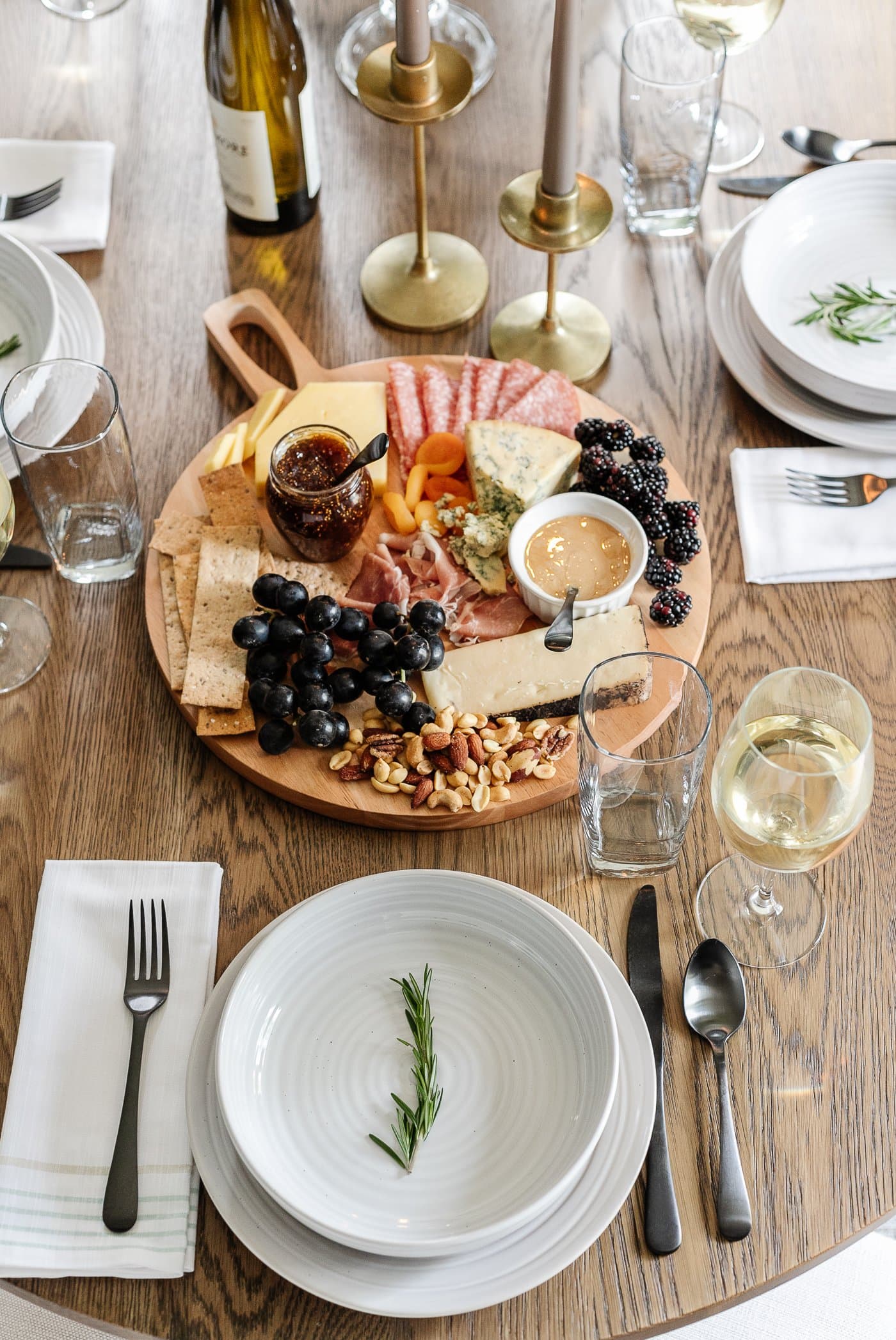 charcuterie board centerpiece on a dinner table