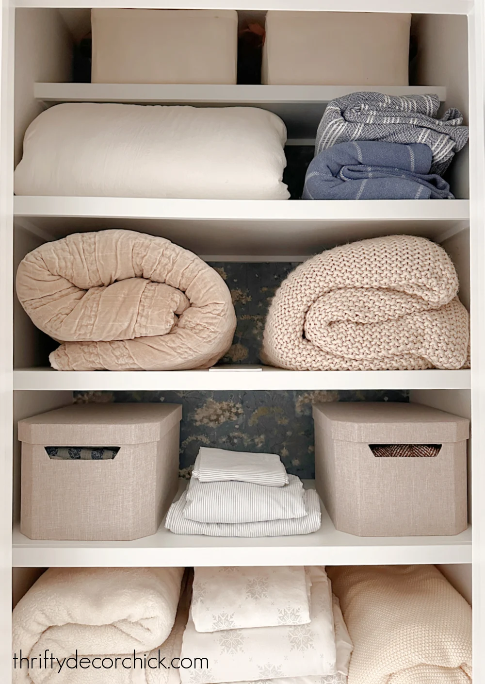 wood shelves in linen closet