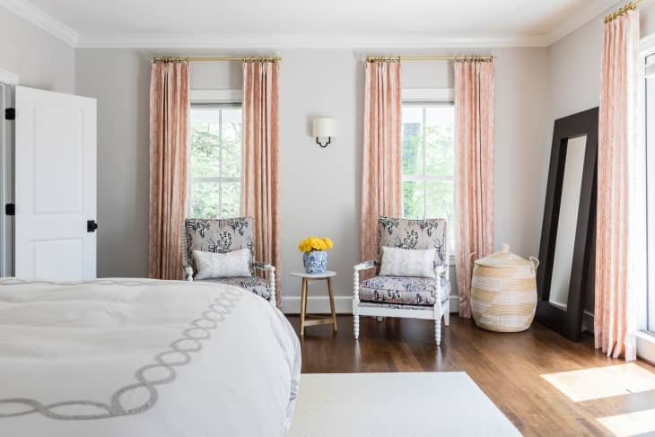 Armchairs side by side in bedroom.