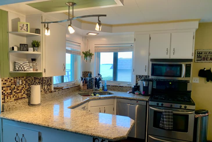 Pendant above kitchen countertops before renovation.