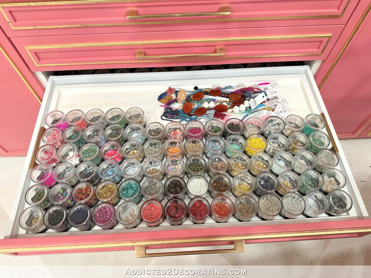 How I store beads for jewelry making -- clear 2-ounce jars on a custom tray made to fit IKEA Sektion drawers