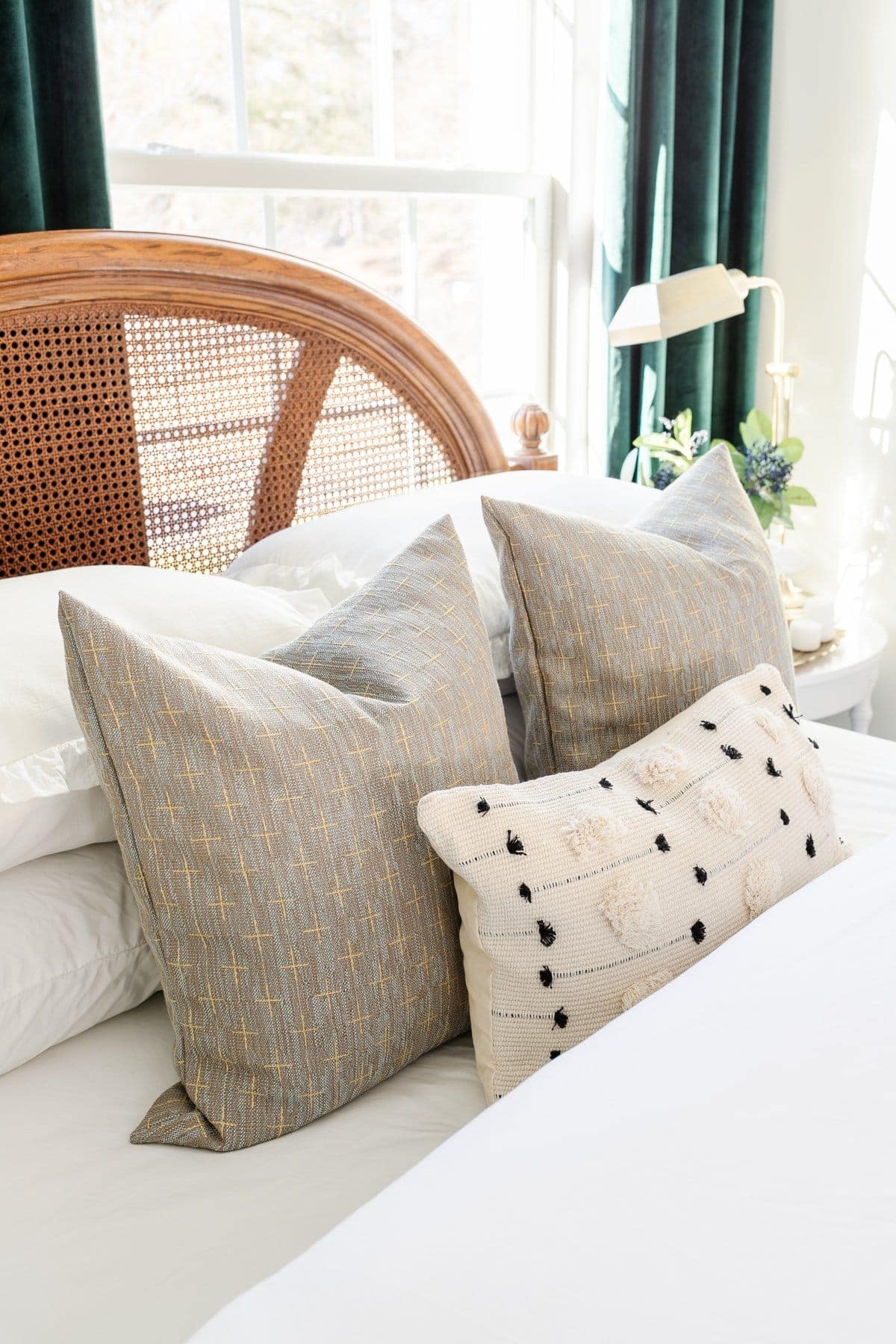 khaki and cream early fall pillows on a bed