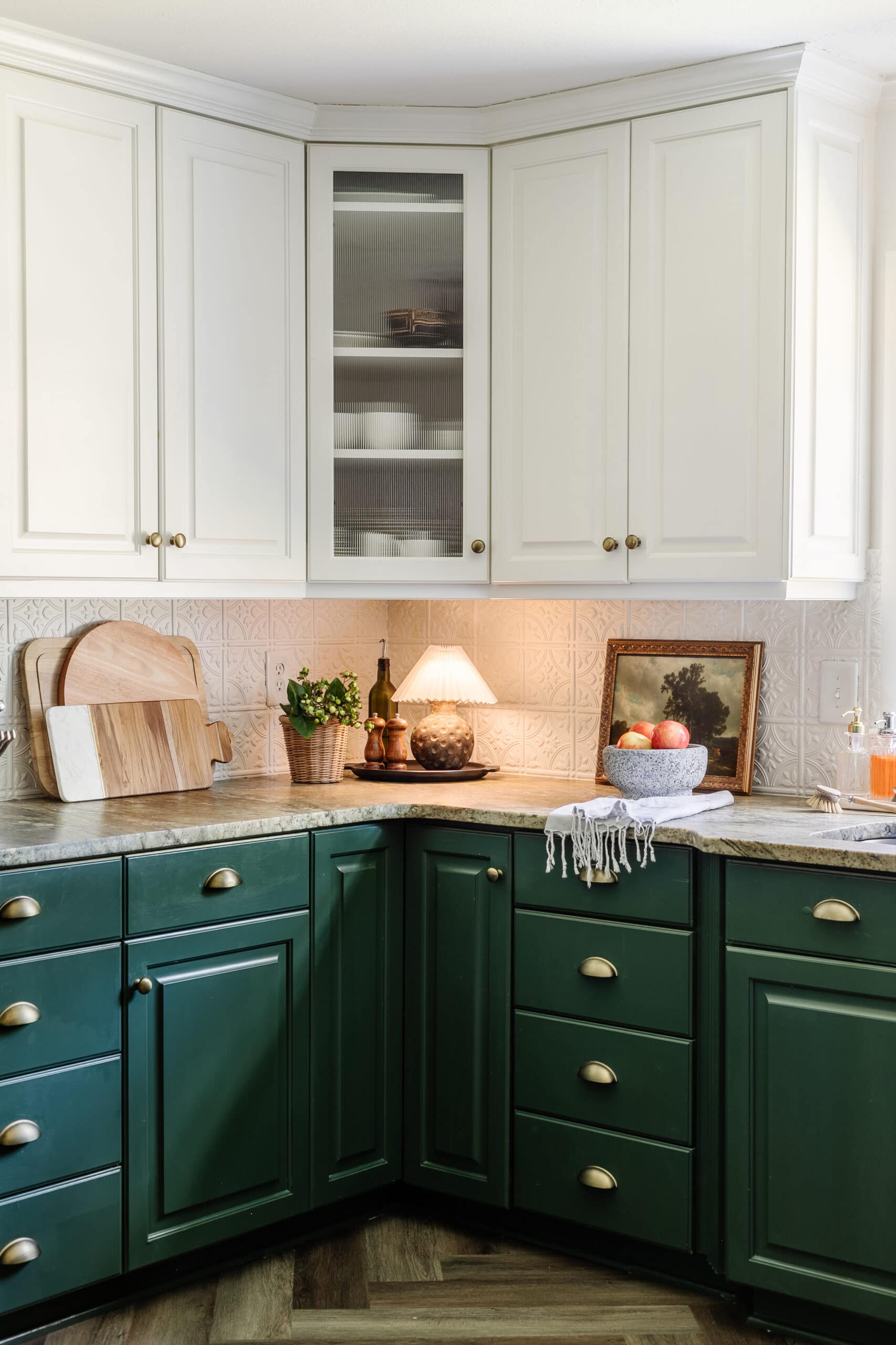 mini lamp on a kitchen countertop with green cabinets