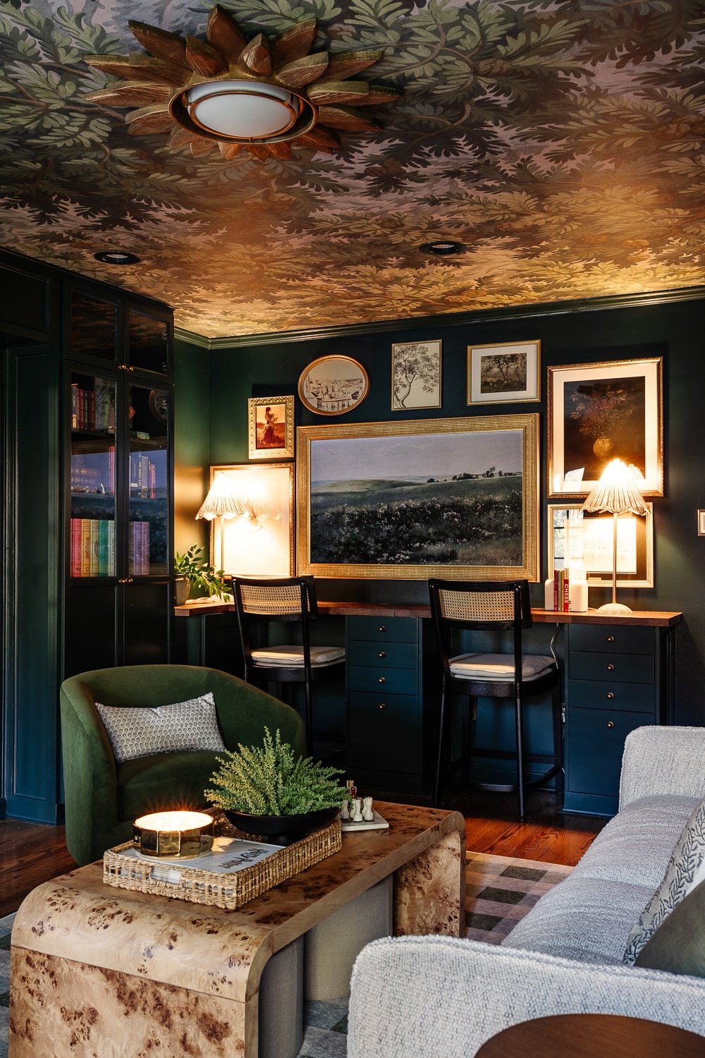 homework desk in a media room with lamps and gallery wall