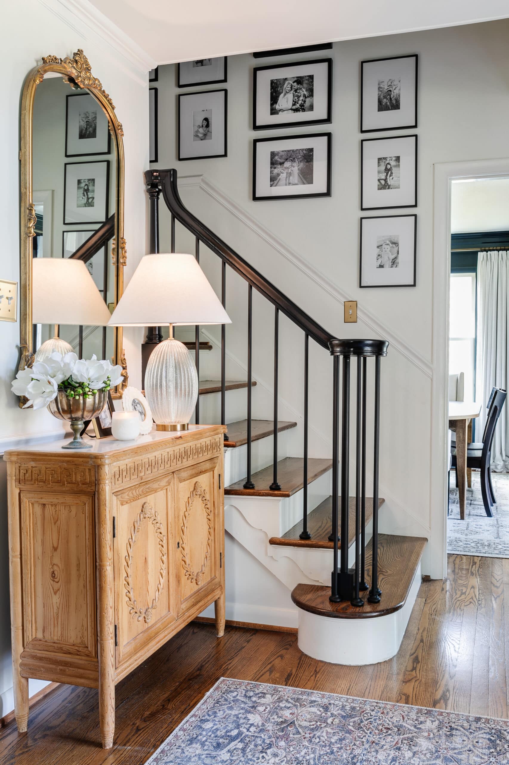 gallery wall on stairs in an entryway