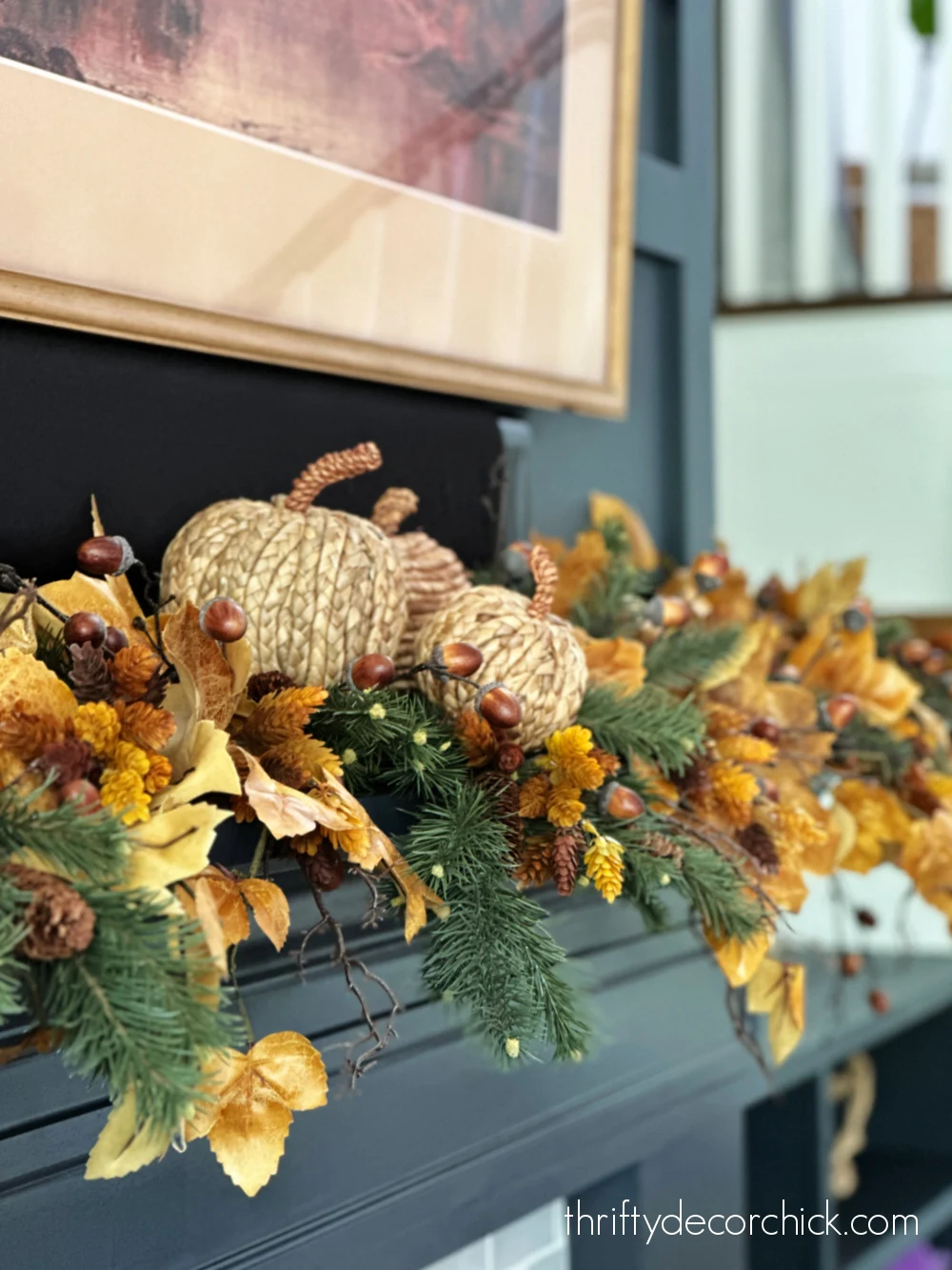 fall mantel with evergreen stems