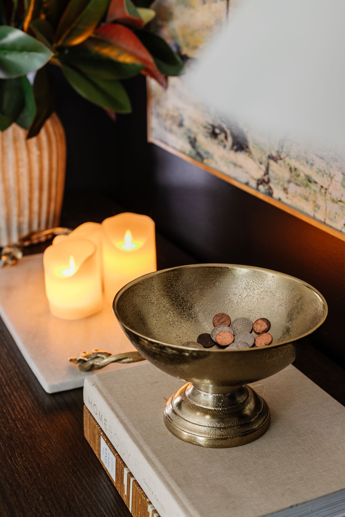 pedestal bowl used as a change holder on a bedroom dresser