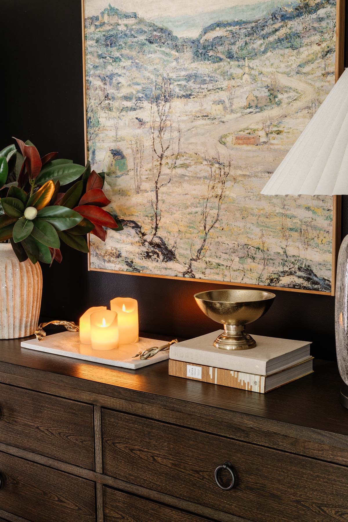 pedestal bowl used as a change holder on a bedroom dresser