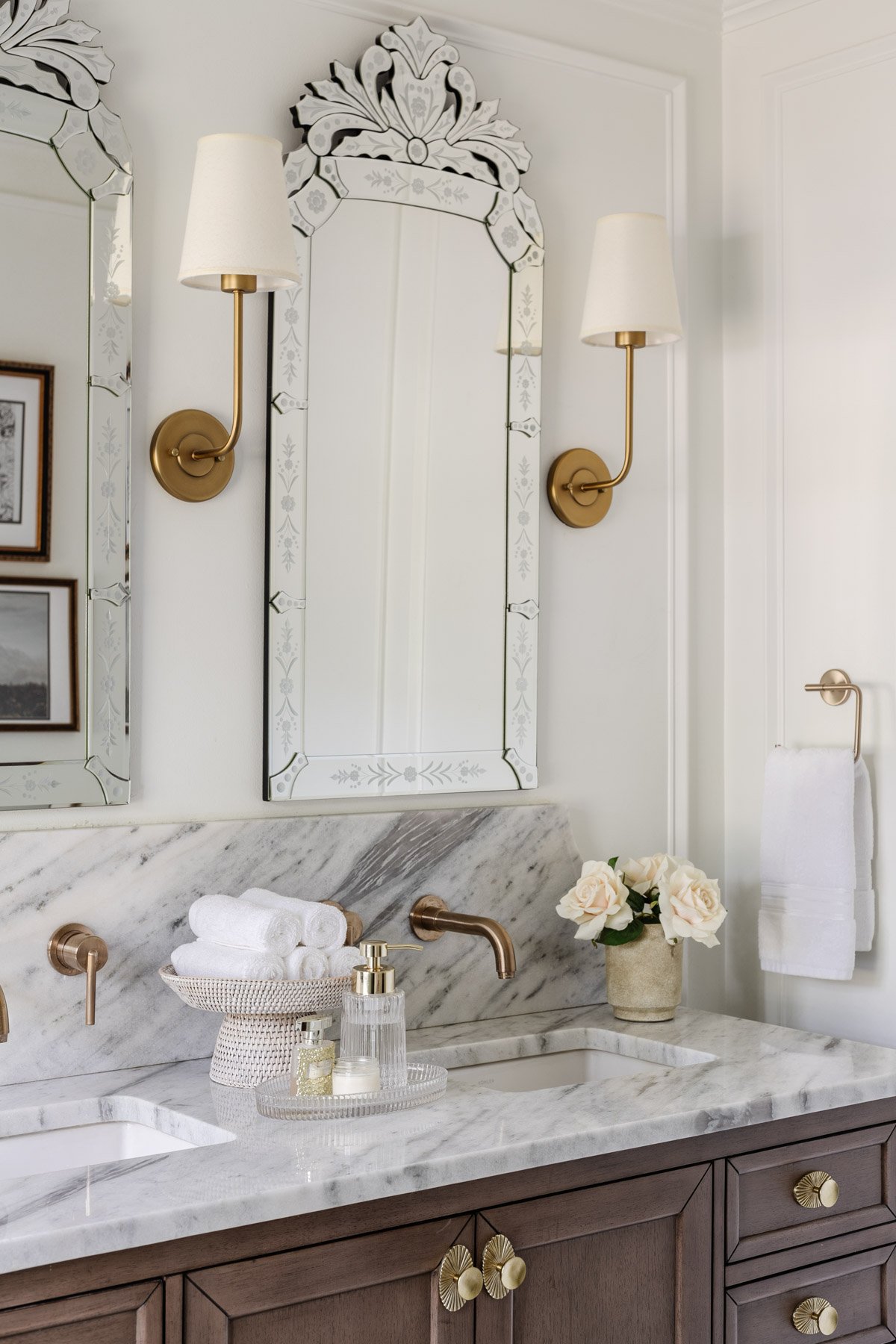 rattan pedestal bowl used as a towel holder on a bathroom countertop