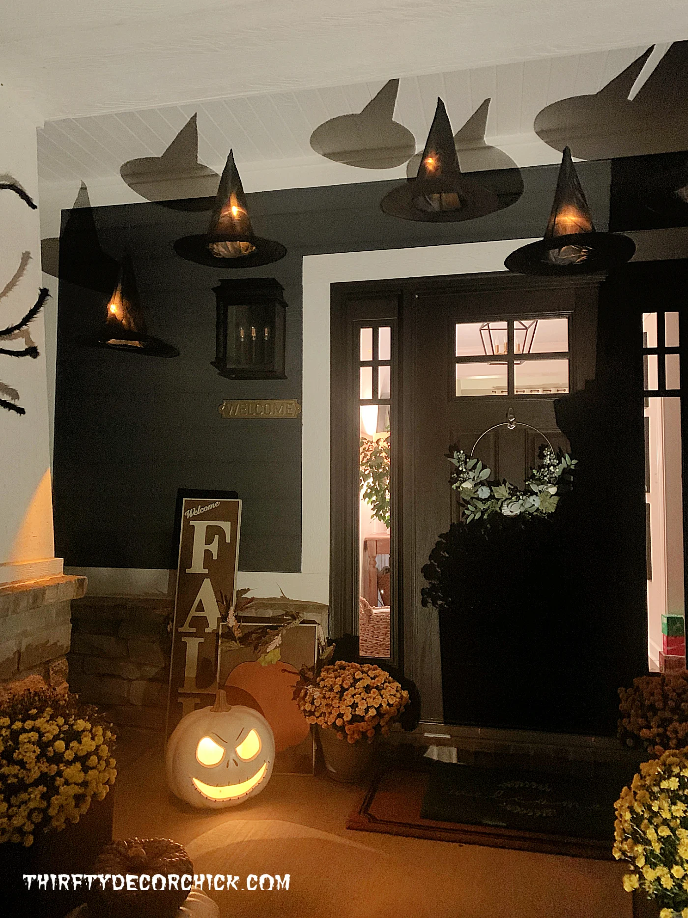 floating Halloween witch hats on front porch