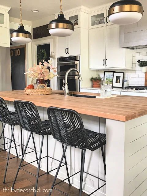 Gray island black chairs butcher block