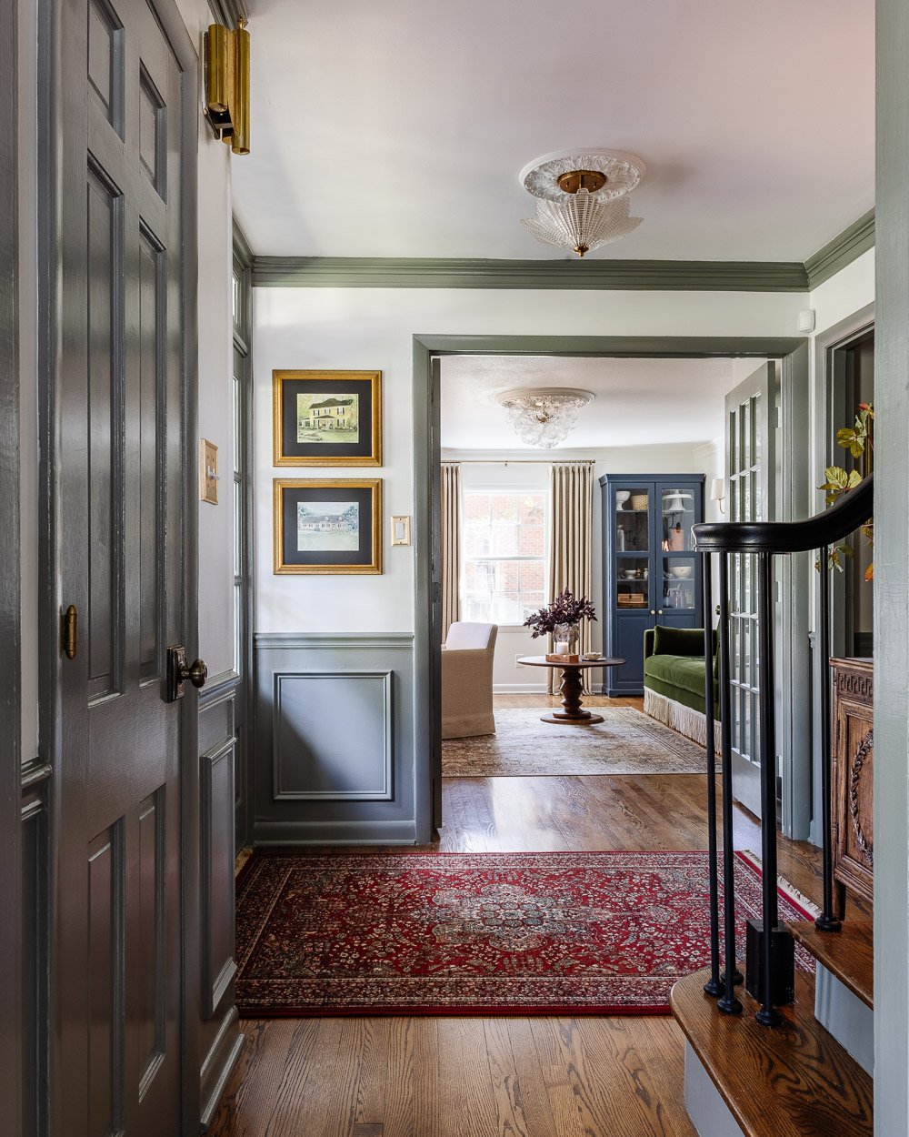 unexpected red theory rug in a foyer