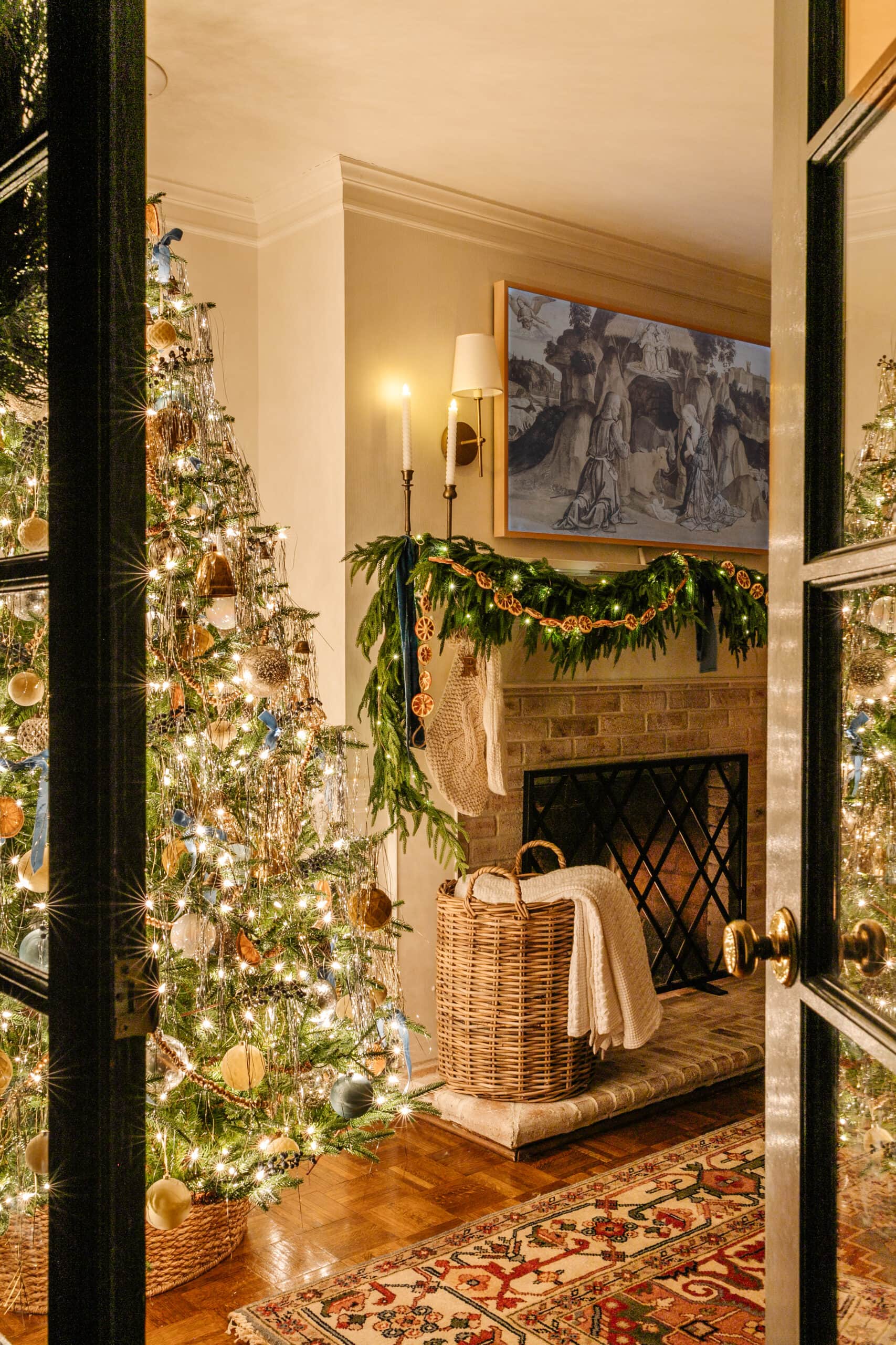 christmas tree lights at night beside fireplace